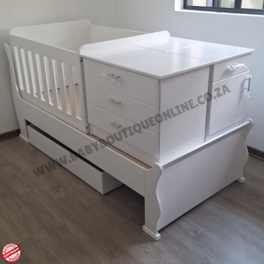 BabyBedroominabox5-in-1SleighCot White baby crib with drawers in a room setting