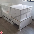 BabyBedroominabox5-in-1SleighCot White baby crib with drawers in a room setting