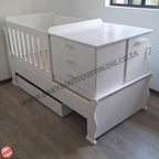 BabyBedroominabox5-in-1SleighCot White baby crib with drawers in a room setting