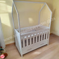 TentLargeCotwithDrawers-White in baby room with wooden floors and brown wall