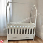 TentLargeCotwithDrawers-White in baby room with wooden floors and brown wall