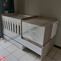 BabyBedroominaBox5-in-1Cot Wooden crib with drawers in a room setting