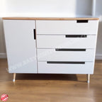 White dresser with wooden top on a wooden floor