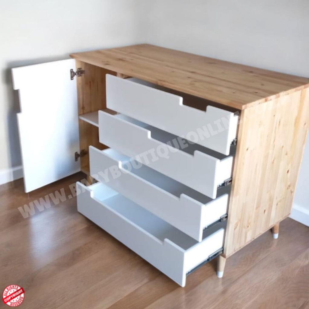Wooden cabinet with white drawers on a wooden floor.