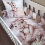 Crib with bunny-themed bedding and decorative pillows