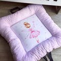 A soft play doughnut for babies with a pink and purple design, featuring a central character illustration.