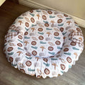 Baby doughnut with animal pattern on a wooden floor