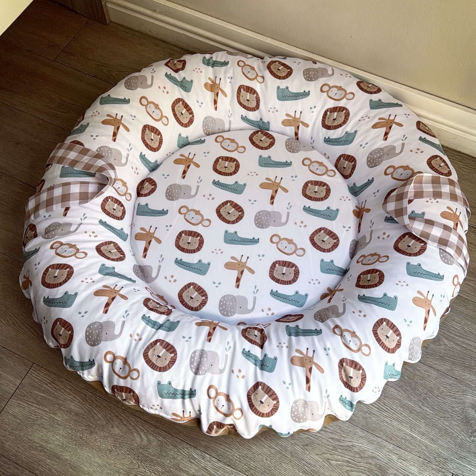 Baby doughnut with animal pattern on a wooden floor