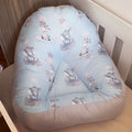 A blue and white safari-themed lounger for toddlers with cloud and star patterns.