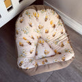 Lounger - Yellow Bee 01 chair with bee and flower pattern on a wooden floor.