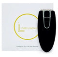 Black hair removal device with Luminia Skincare box in the background