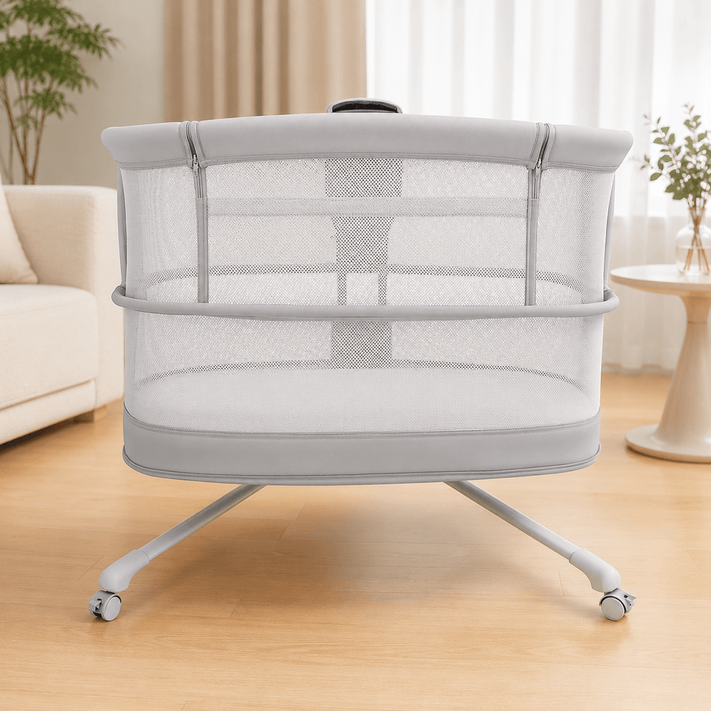 Portable dream starlight crib with mesh sides on a wooden floor in a room with a couch and plants.