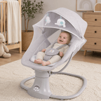 Baby in a gray baby swing with a crib, dresser, and plant in the background