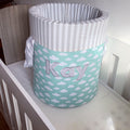 Children's laundry basket with cloud pattern and 'Kay' branding on a white surface.