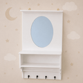 White wall-mounted nursery cabinet with an oval mirror, open shelf, and four black hooks, shown against a beige wall with cloud and star decals.