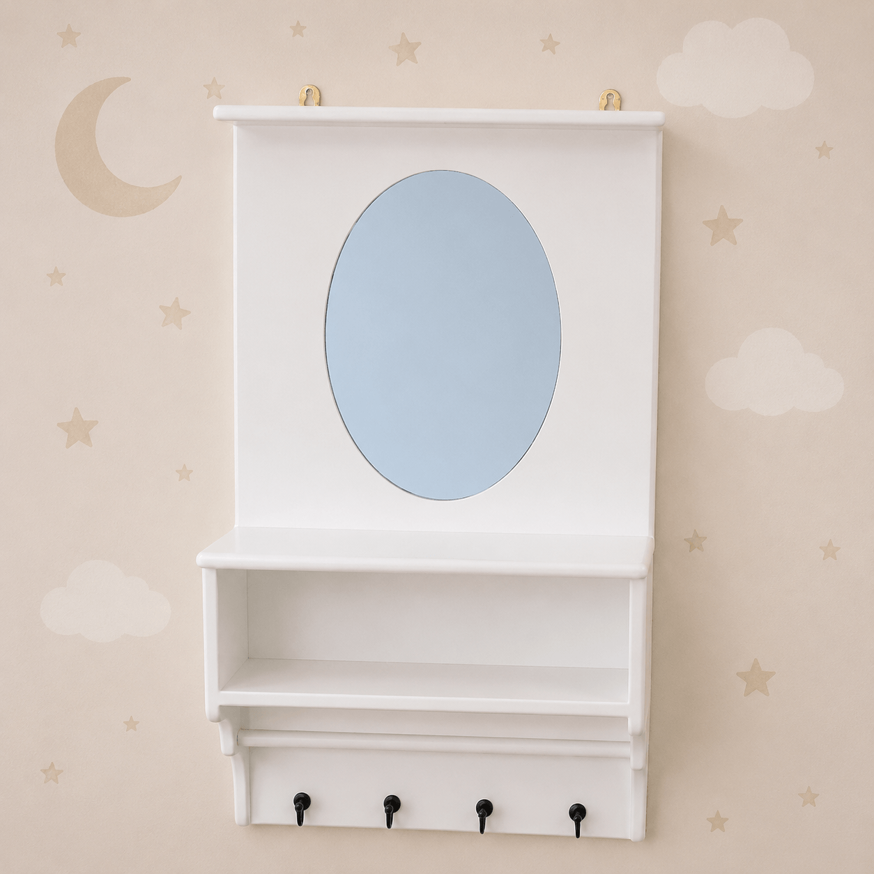 White wall-mounted nursery cabinet with an oval mirror, open shelf, and four black hooks, shown against a beige wall with cloud and star decals.