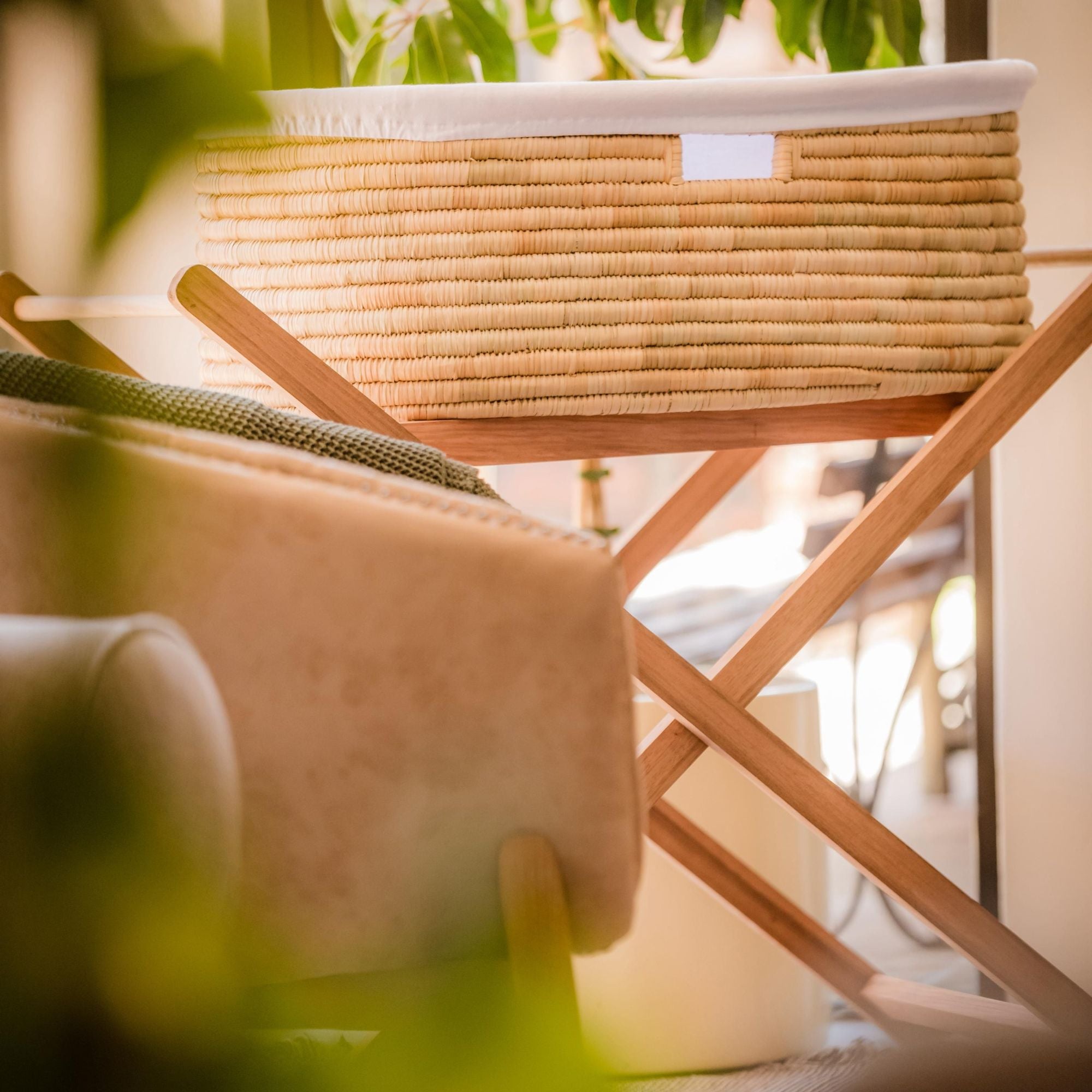 Woven basket on a wooden shelf with a blurred background